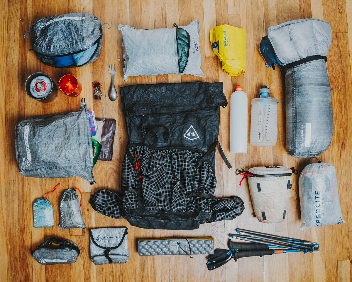 Collection of Hyperlite Mountain Gear hiking gear on a wooden floor