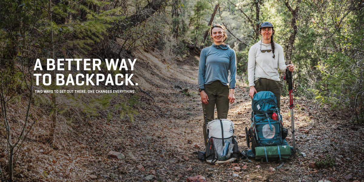Two people hiking in a forest with backpacks and a quote about a better way to backpack.