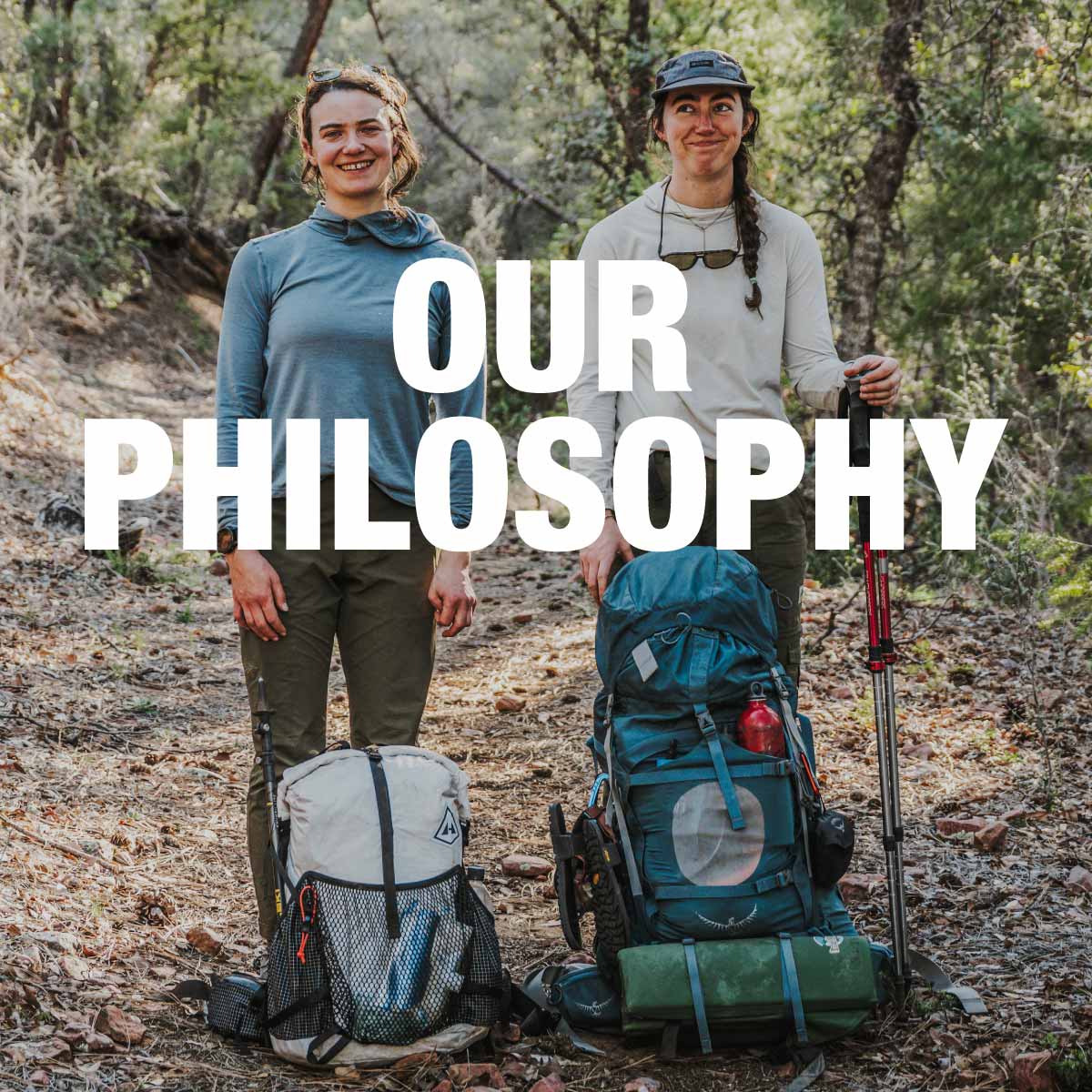 Two people with hiking backpacks and a trekking pole in a forest setting, with 'OUR PHILOSOPHY' text overlay.