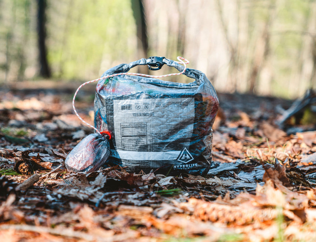 10L Roll-Top Food Bag Kit by Hyperlite Mountain Gear sitting on the forest floor