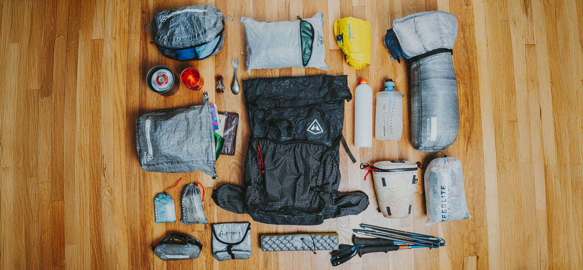 Collection of Hyperlite Mountain Gear hiking gear on a wooden floor