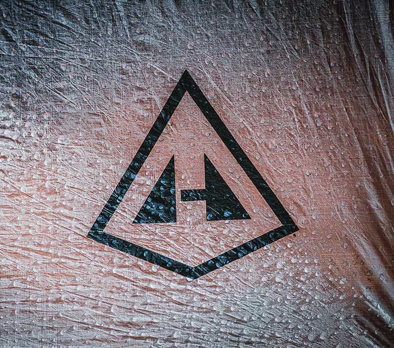 Black Hyperlite logo on a textured surface