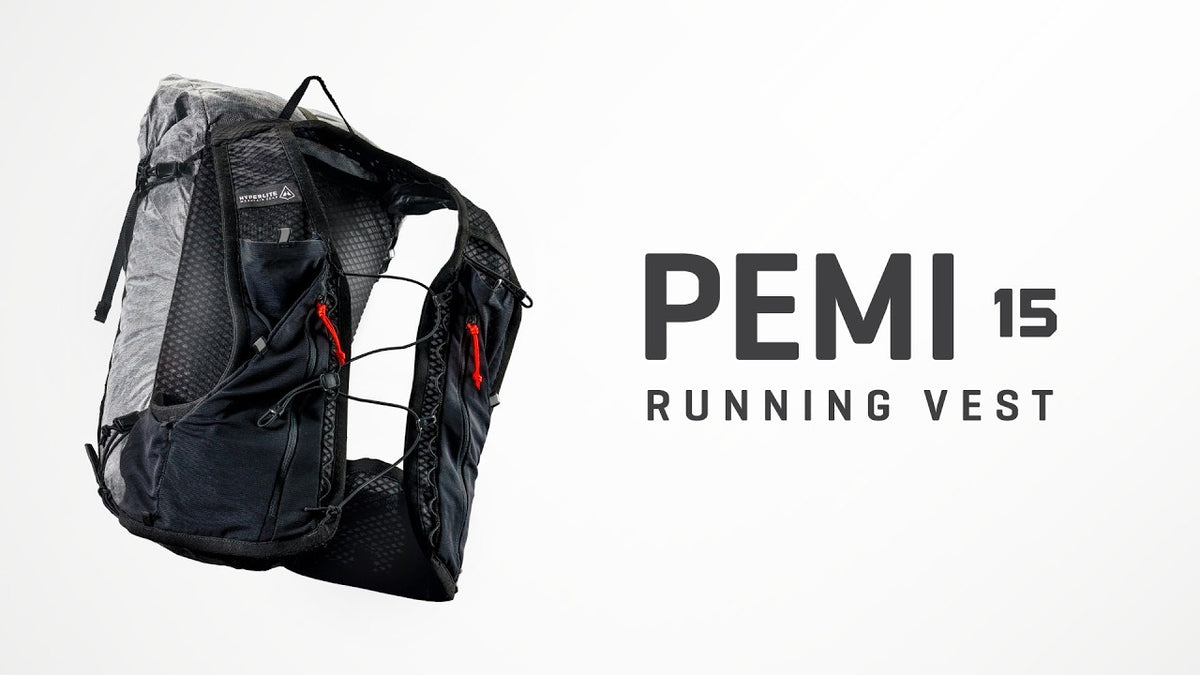 Black running vest with red accents on a white background, featuring the brand 'PEMI'.